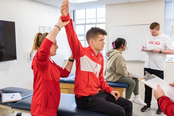 students working together in a kinesiology class