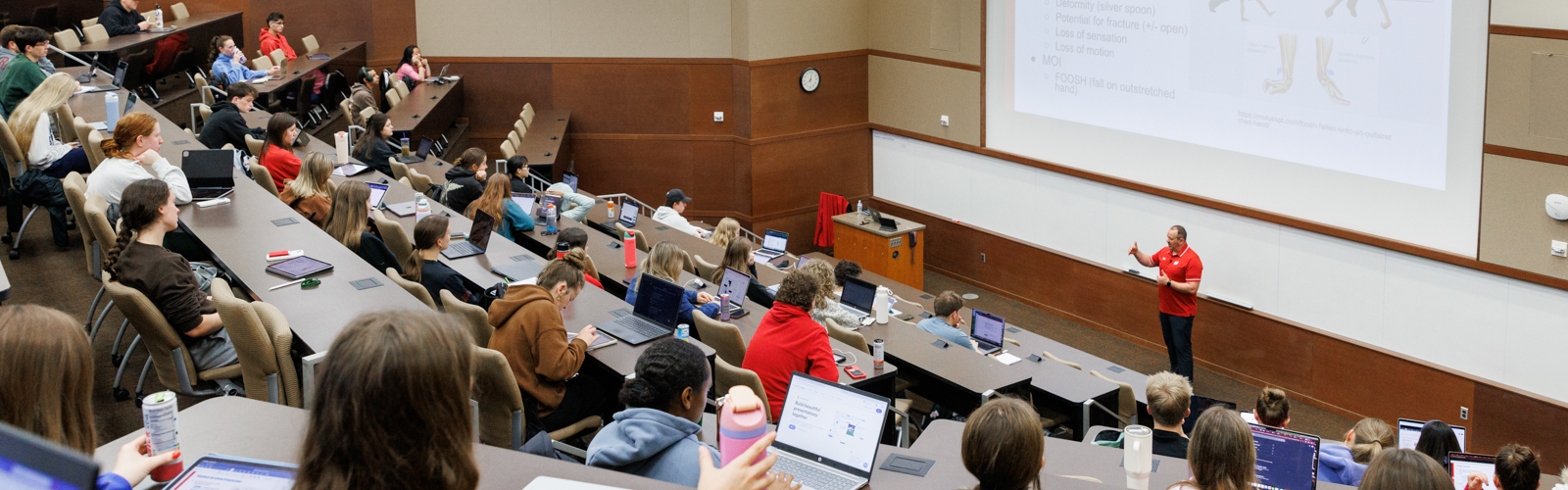 a college teacher teaching a class