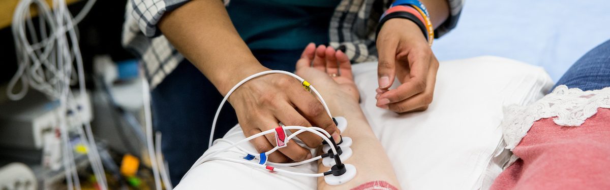 person checking the pulse of someone